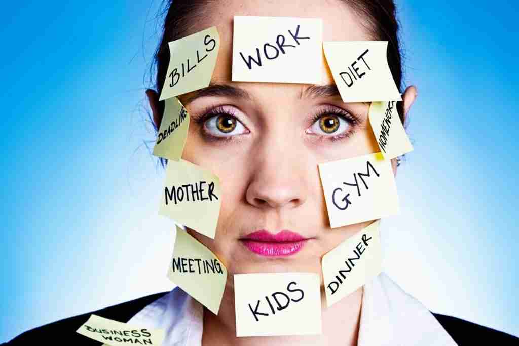 Woman with post its on her face listing all the things which are causing her language burnout 